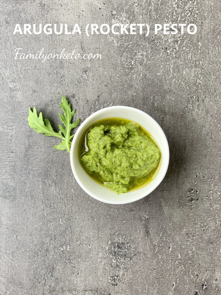 Picture of keto arugula pesto o a grey table