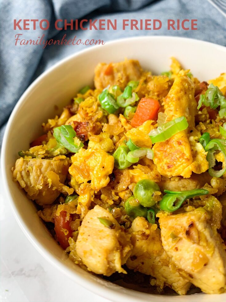 Picture of a bowl fill of keto chicken fried rice with vegetables and cauliflower rice