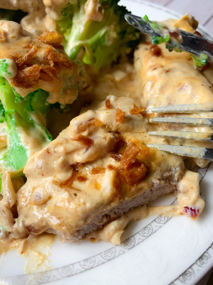 Picture of low carb veal steaks with caramelized onion sauce and steamed broccoli