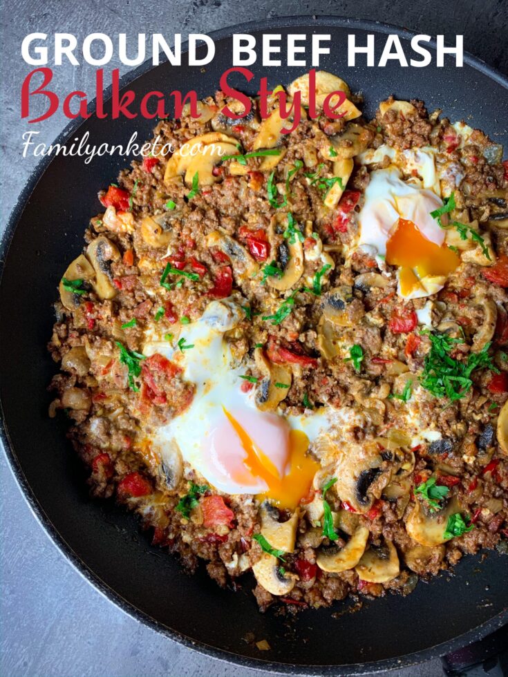 Ground beef hash in Balkan style with peppers, feta cheese and eggs in one skillet.